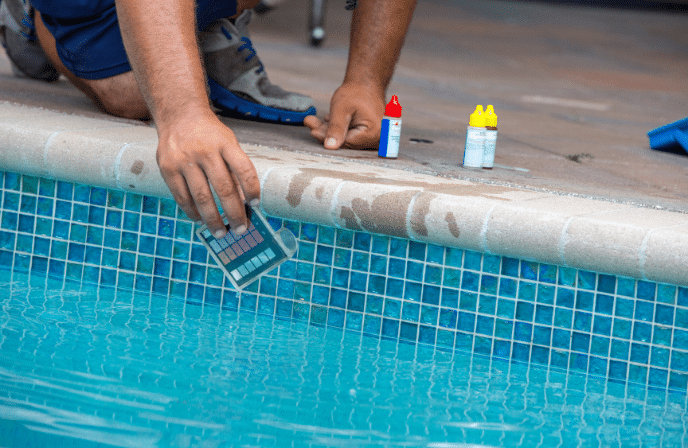 Pool water balancing - contractor testing pool water